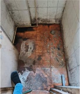 Deteriorated hospital washroom before renovation (2)